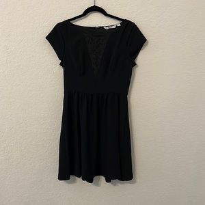 Black dress with lace detail.